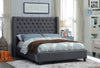 Grey Fabric Wing Bed with Deep Button Tufting and Nailhead Details